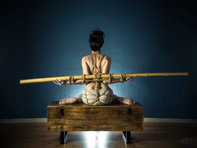 Hands tied behind her back