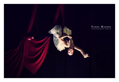 graceful aerial acrobat in balletic pose