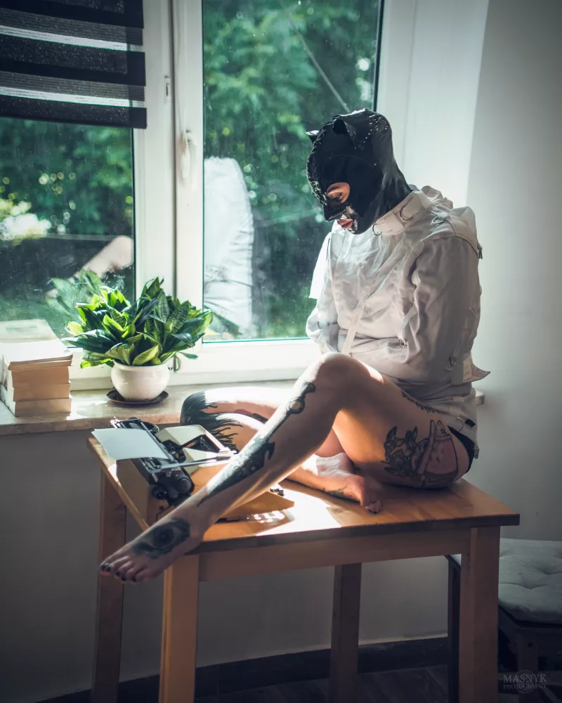  Woman in latex mask and collar