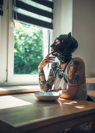  Woman in latex mask and collar