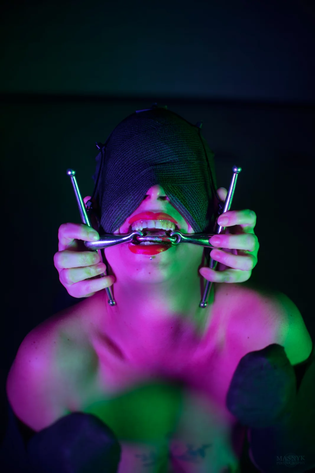 Woman blinded by mask poses for photo