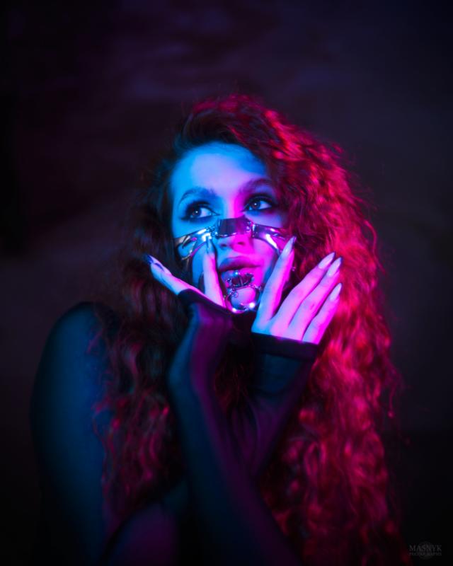 Artistic portrait of a woman with colorful lighting