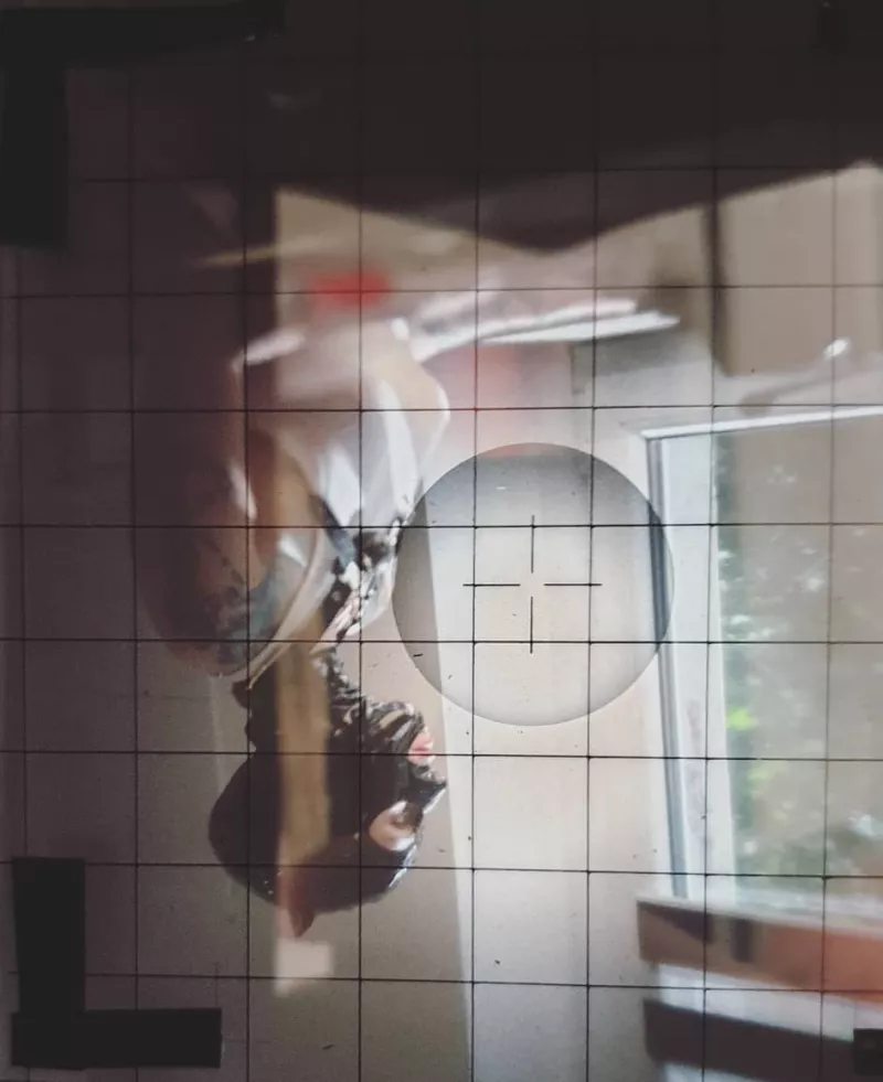 Woman in a latex mask. Photo taken with a large format camera.