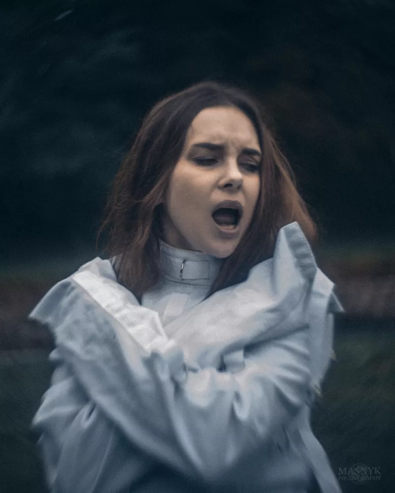  A beautiful woman in a straitjacket. Portrait