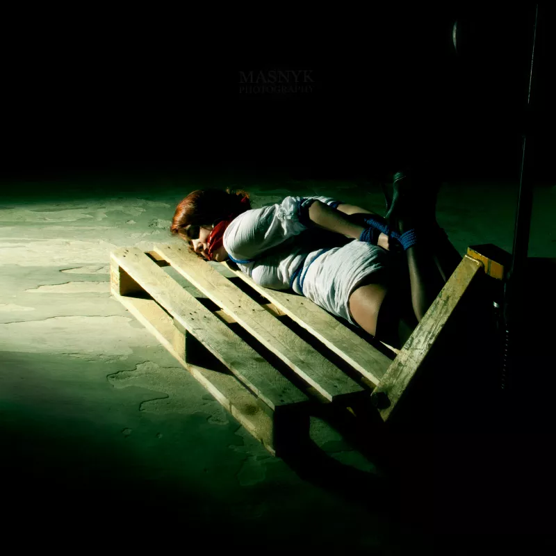 Bound and gagged woman on pallet jack