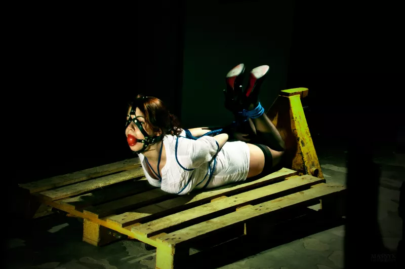Bound and gagged woman on pallet jack