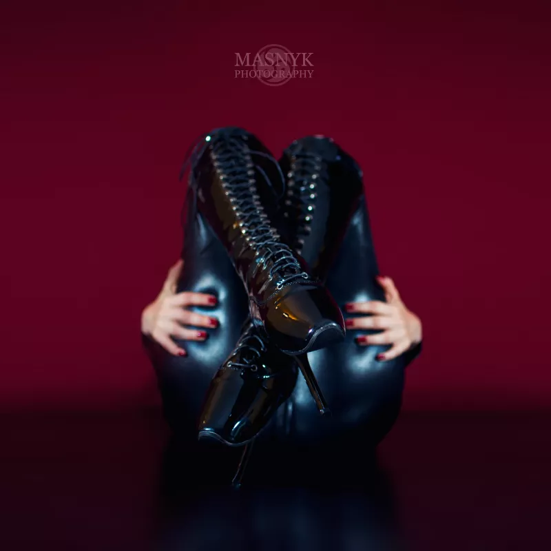 Sexy woman ass in latex catsuit