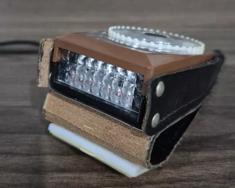Vintage selenium light meter on a wooden surface