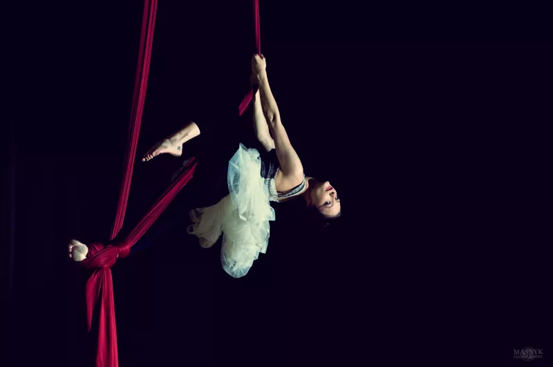 graceful aerial acrobat in balletic pose