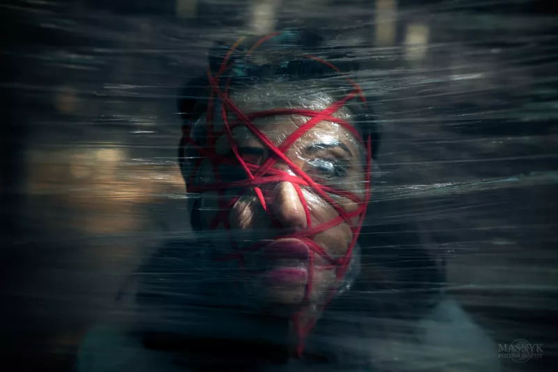  Face wrapped with rope and foil. photo horror