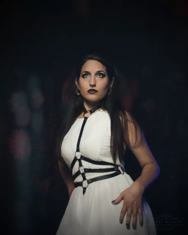 Woman in a white dress with dark makeup