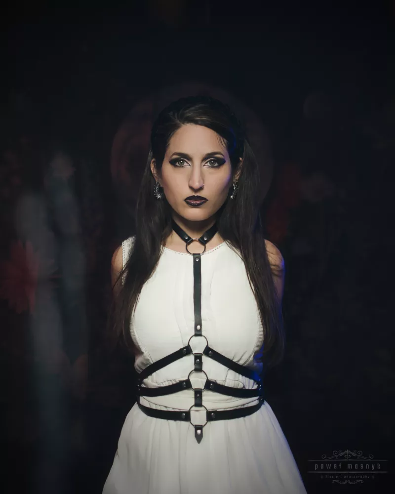 Woman in a white dress with dark makeup