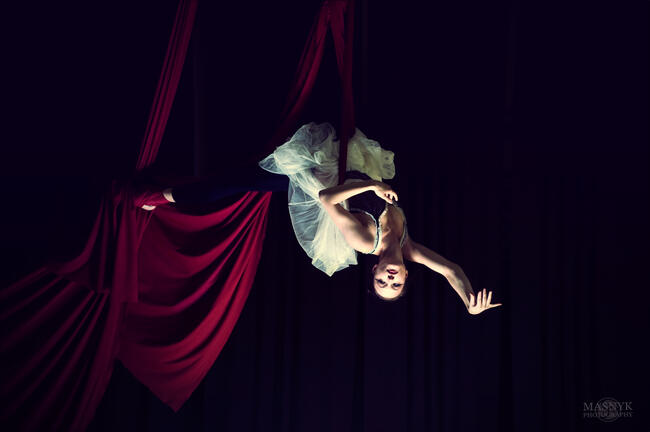 graceful aerial acrobat in balletic pose