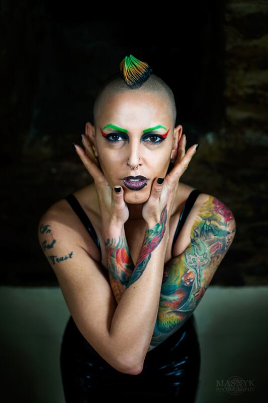 tattooed woman with piercing and dyed hair