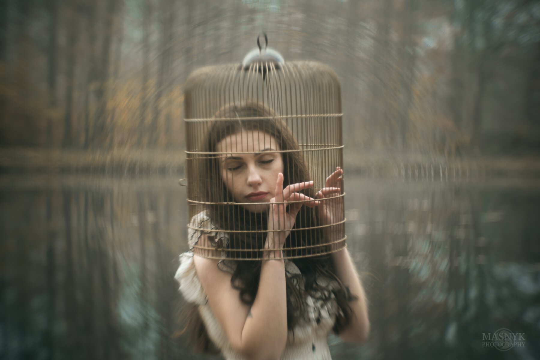 Dreamy woman with her head in a cage
