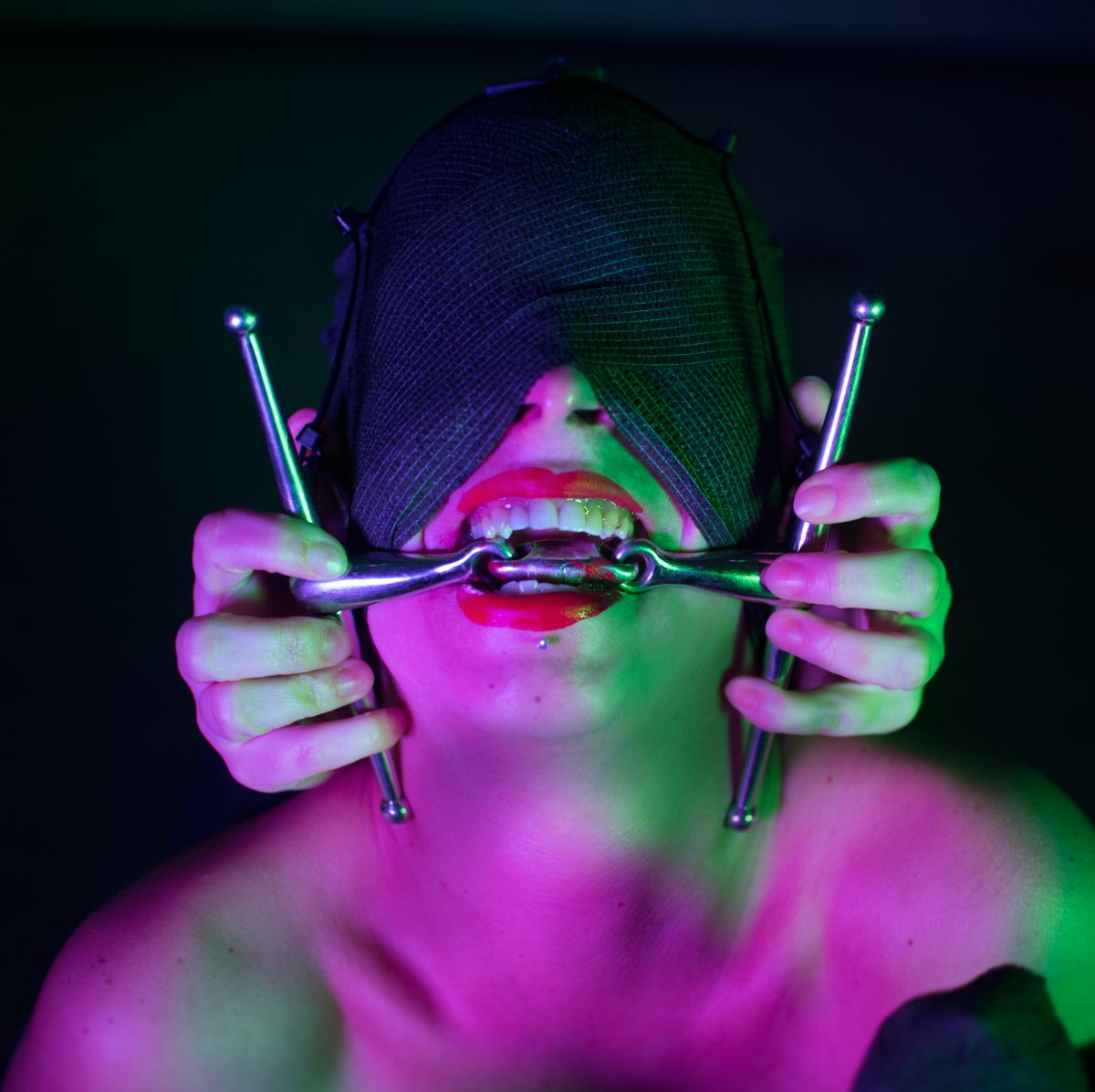 Woman blinded by mask poses for photo