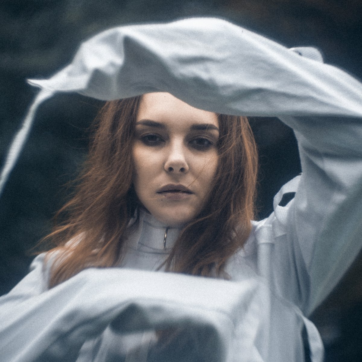  A beautiful woman in a straitjacket. Portrait