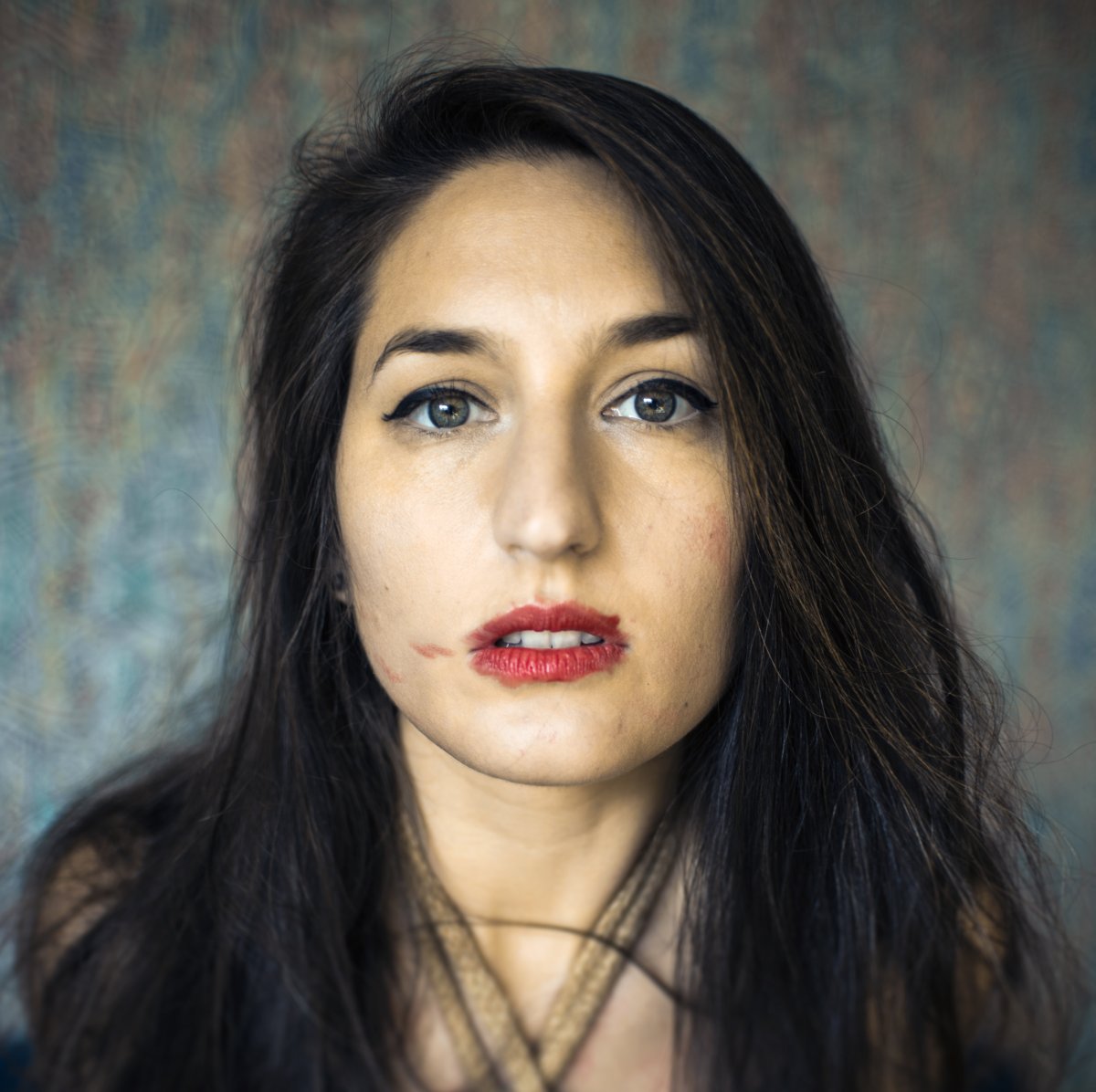 Tied up woman with smudged lipstick