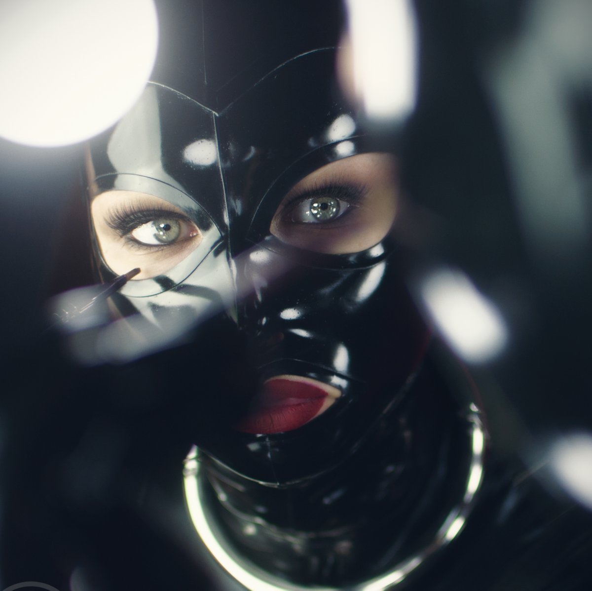 Woman wearing a collar and latex mask