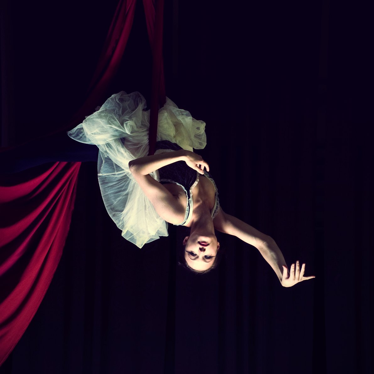 graceful aerial acrobat in balletic pose