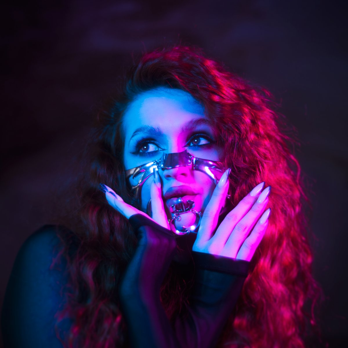 Artistic portrait of a woman with colorful lighting