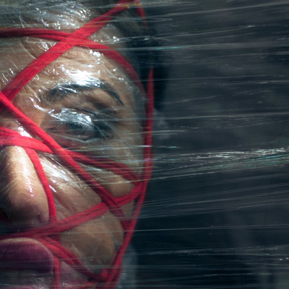  Face wrapped with rope and foil. photo horror