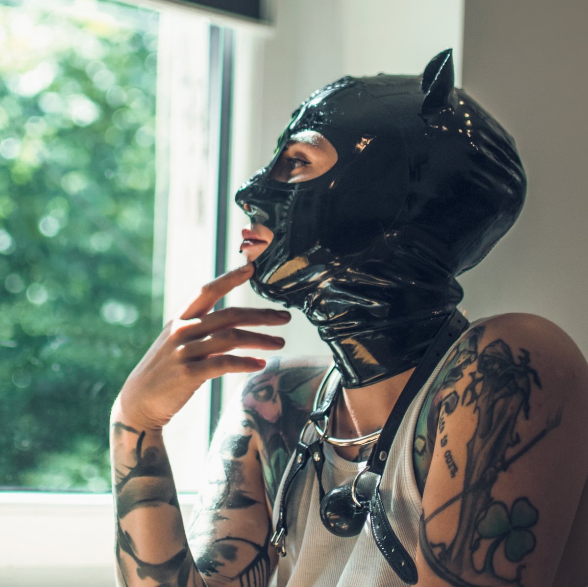  Woman in latex mask and collar