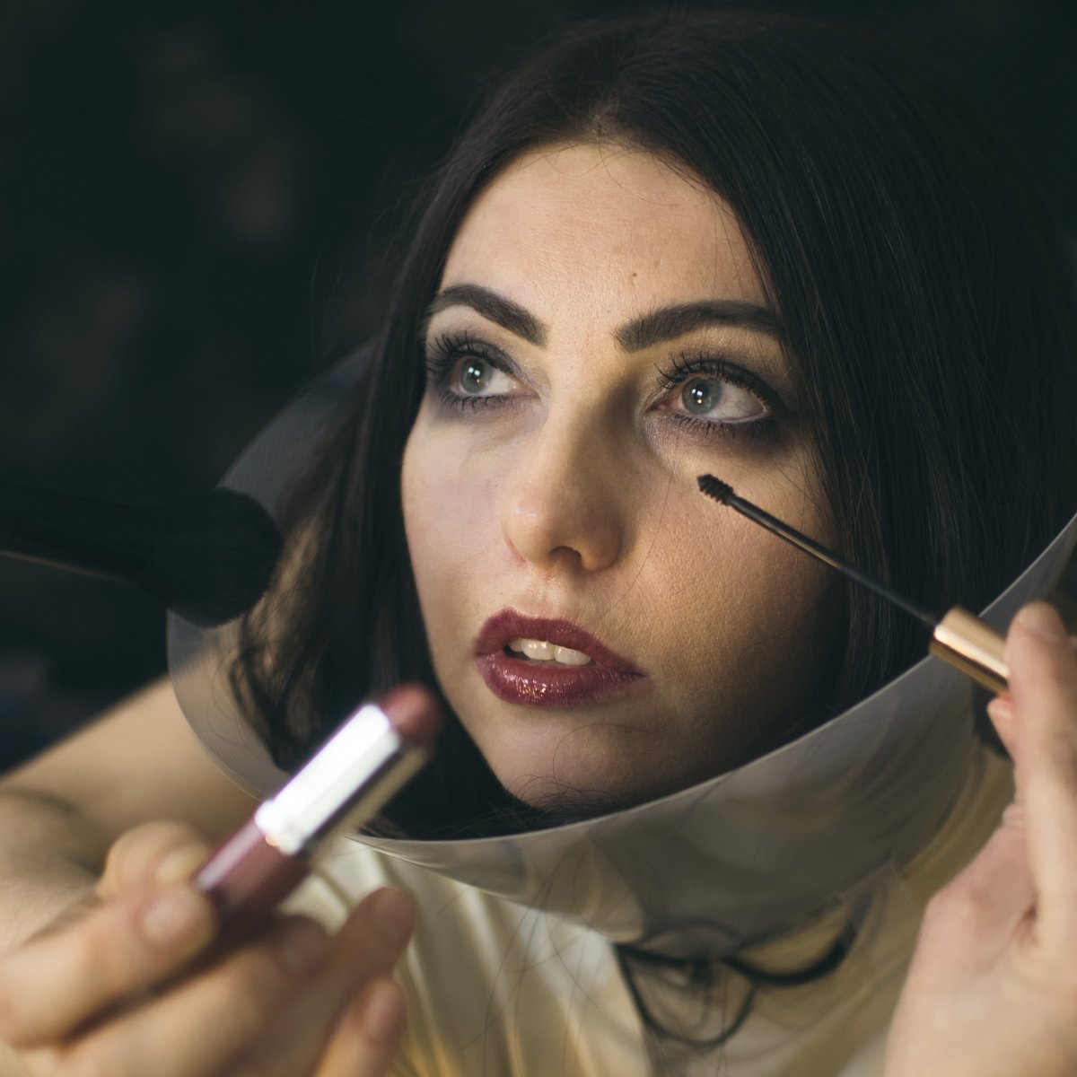 Woman in Elizabethan collar. Vet collar.